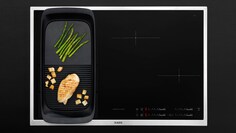 En MaxiSense Combi induksjonskoketopp med en plancha-grill